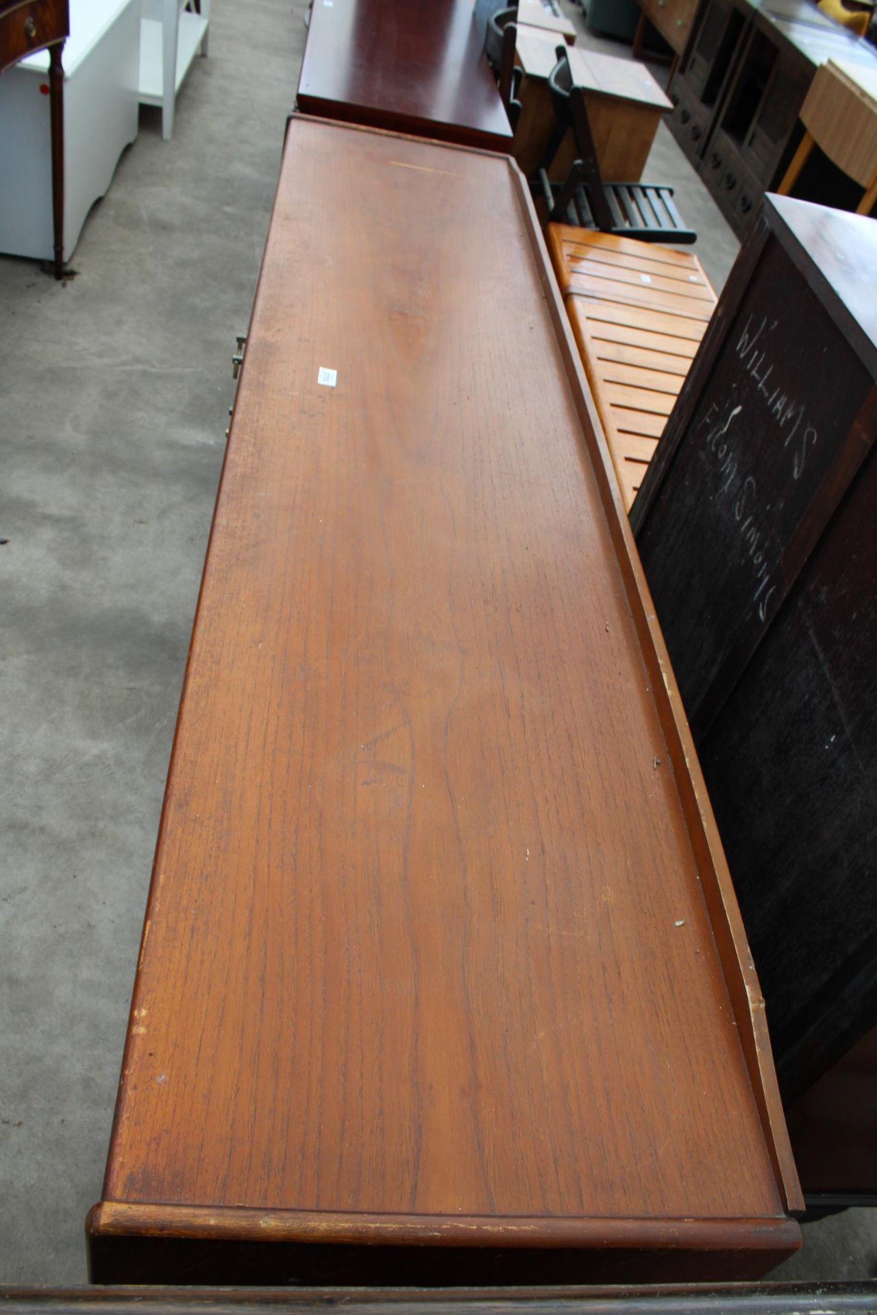 A RETRO TEAK SIDEBOARD ENCLOSING THREE DRAWERS AND THREE CUPBOARDS, 78" WIDE - Image 2 of 4