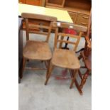 A PAIR OF MID 20TH CENTURY ELM AND BEECH KITCHEN CHAIRS