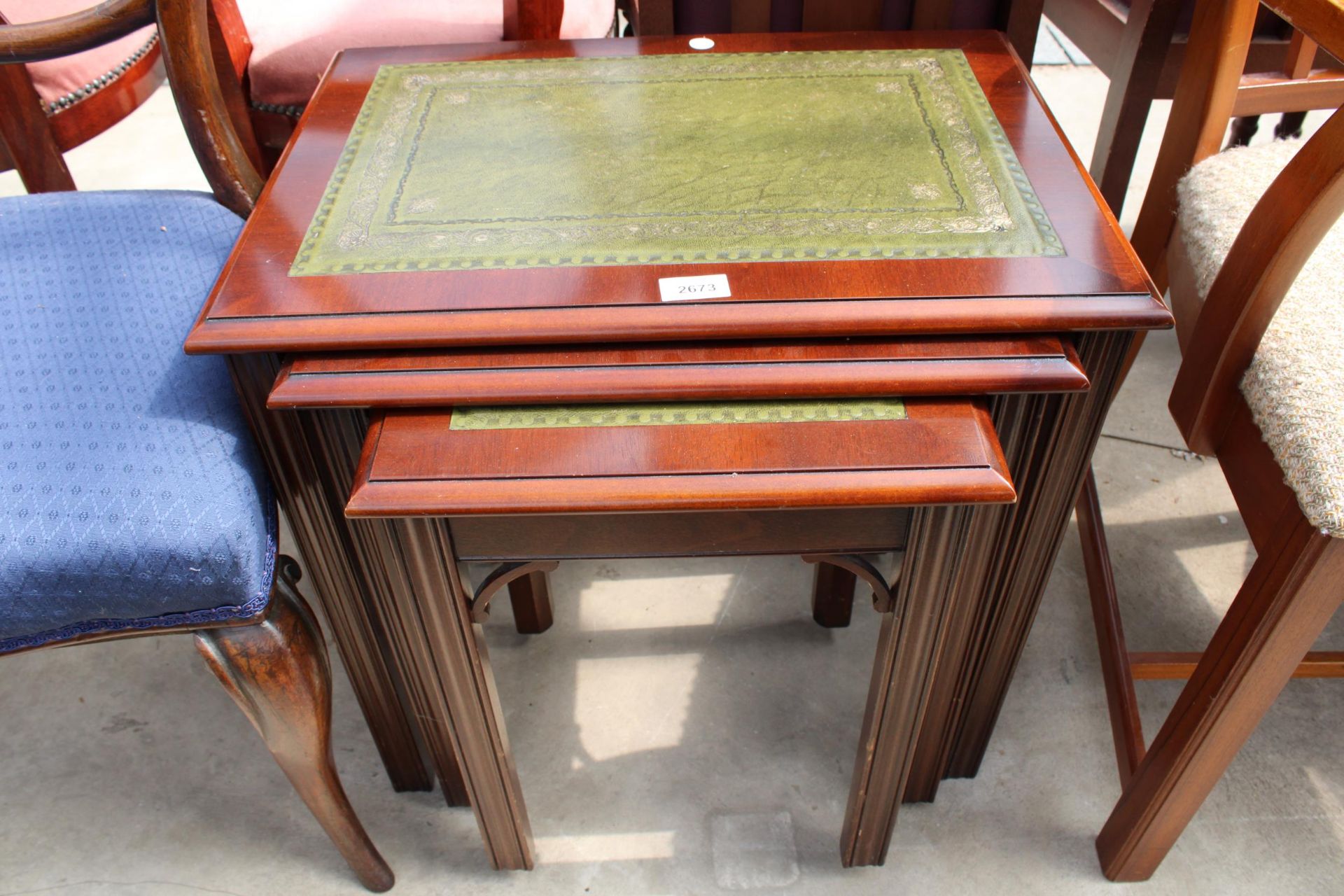 A NEST OF THREE MAHOGANY TABLES WITH INSET LEATHER TOPS AND A PAIR OF VICTORIAN PARLOUR CHAIRS - Image 3 of 4