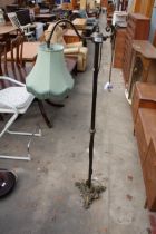 A VICTORIAN STYLE READING STANDARD LAMP ON BRASS COLUMN AND BASE WITH SHADE