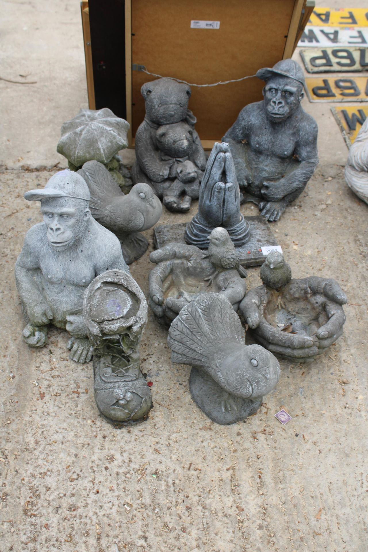 TEN CONCRETE GARDEN FIGURES TO INCLUDE BEARS, A GORILLA AND A DOVE ETC