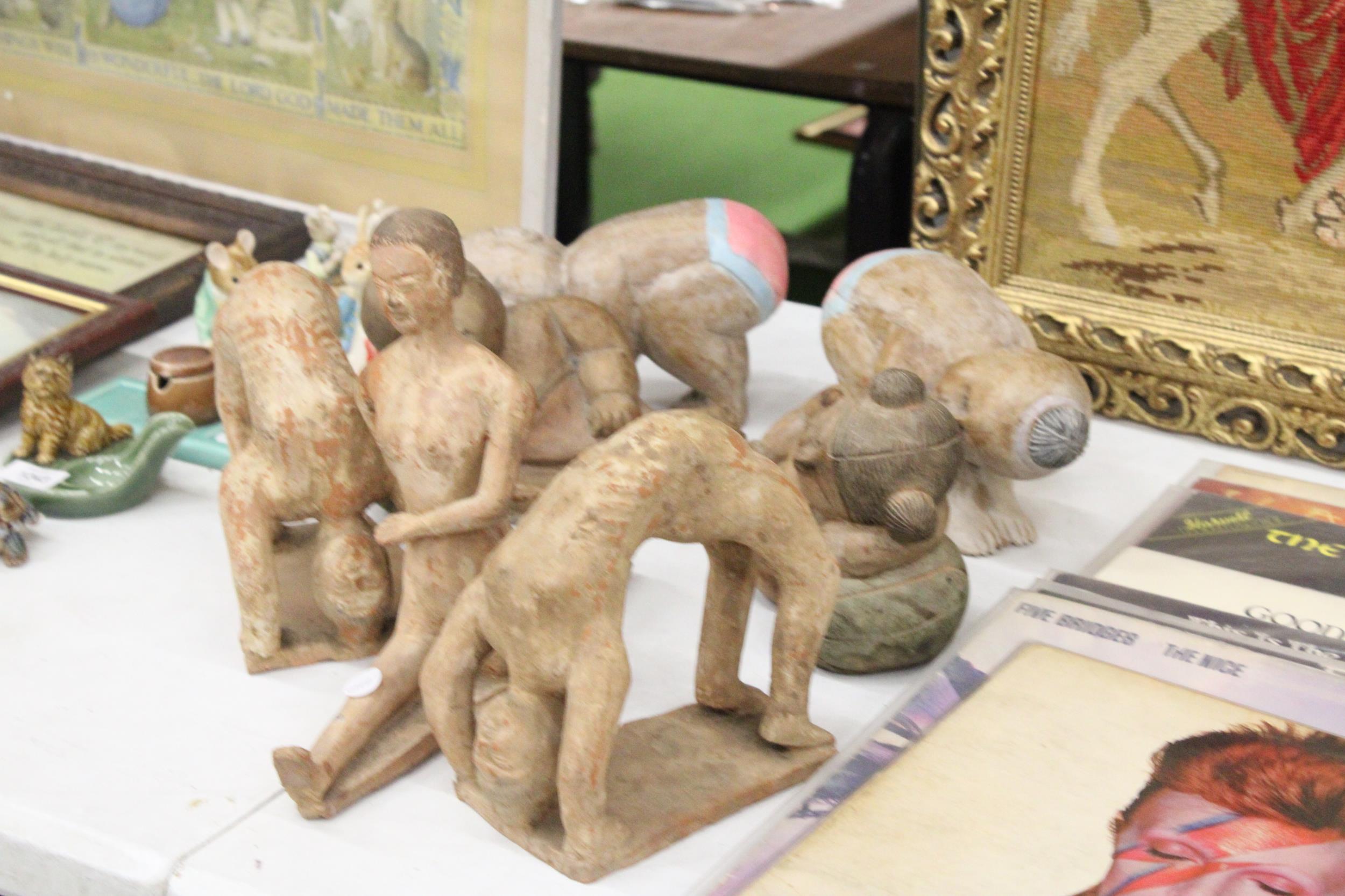 THREE LARGE CLAY MODELS OF GYMNASTS, PLUS FOUR WOODEN BABY BUDDAHS - Image 5 of 5