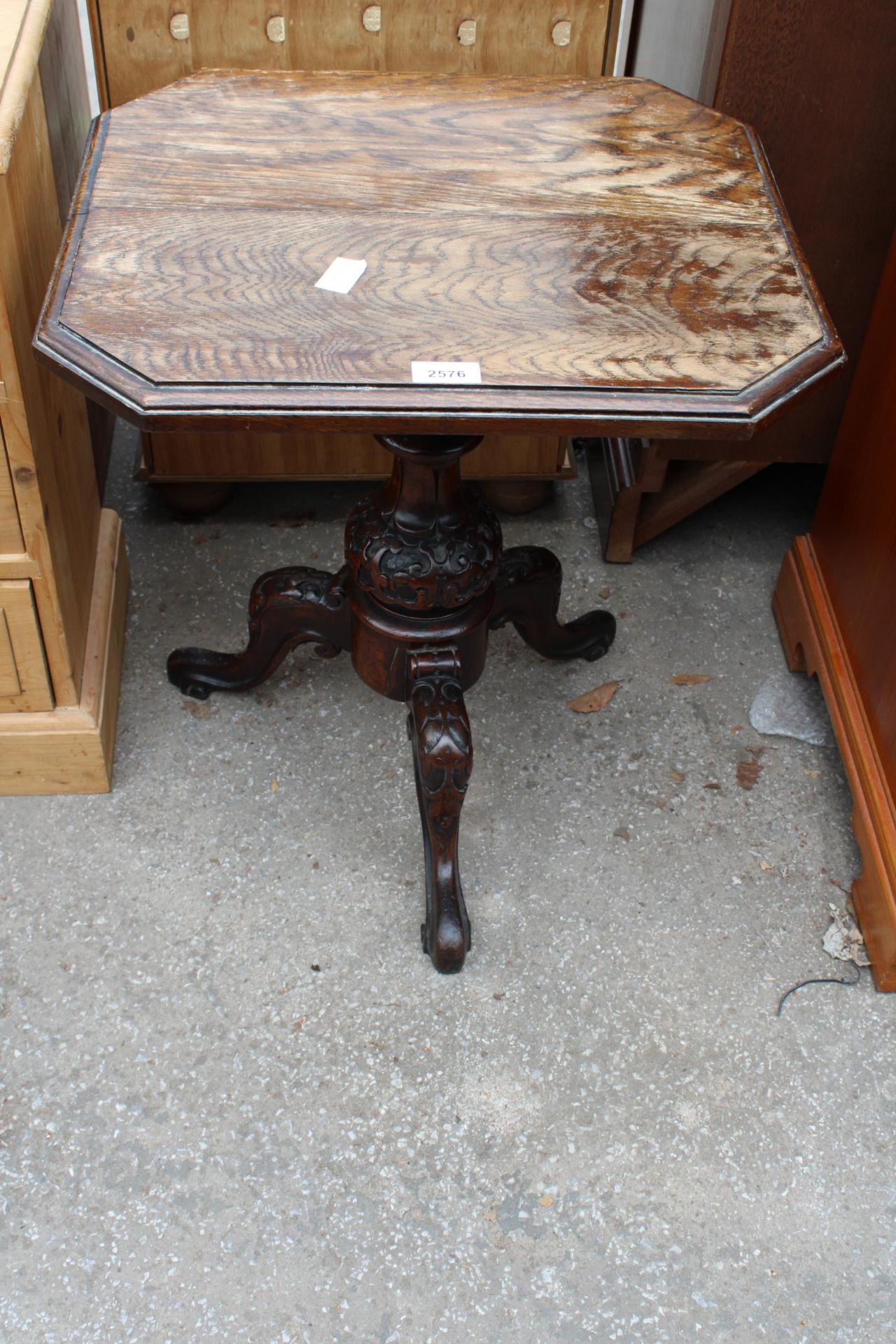 AN OAK OCCASIONAL TABLE ON VICTORIAN MAHOGANY TRIPOD BASE