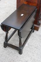 A MODERN OAK MINIATURE DROP LEAF TABLE