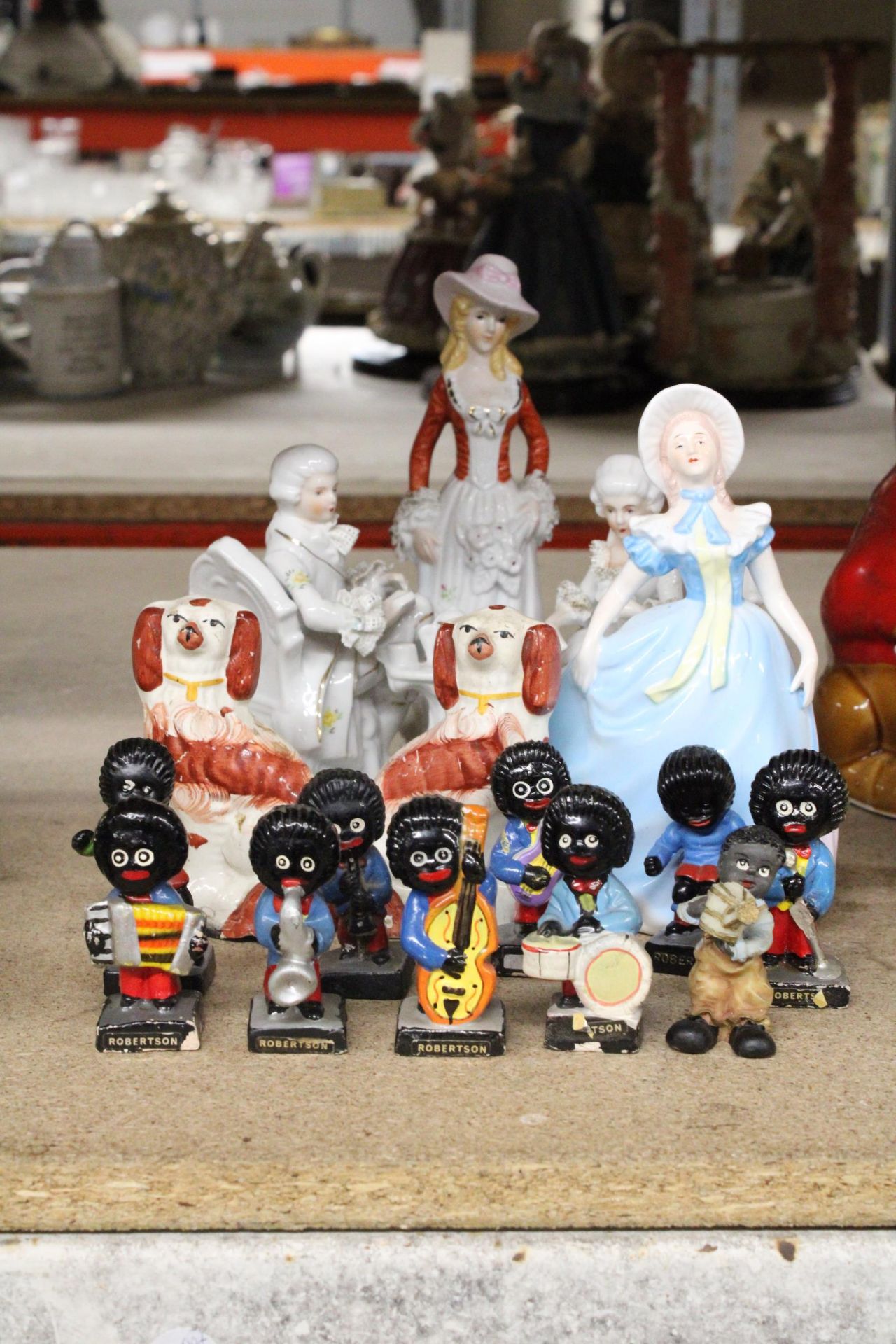 A COLLECTION OF FIGURES TO INCLUDE ROBERTSON'S BAND MEMBERS, SMALL STAFFORDSHIRE STYLE DOGS AND
