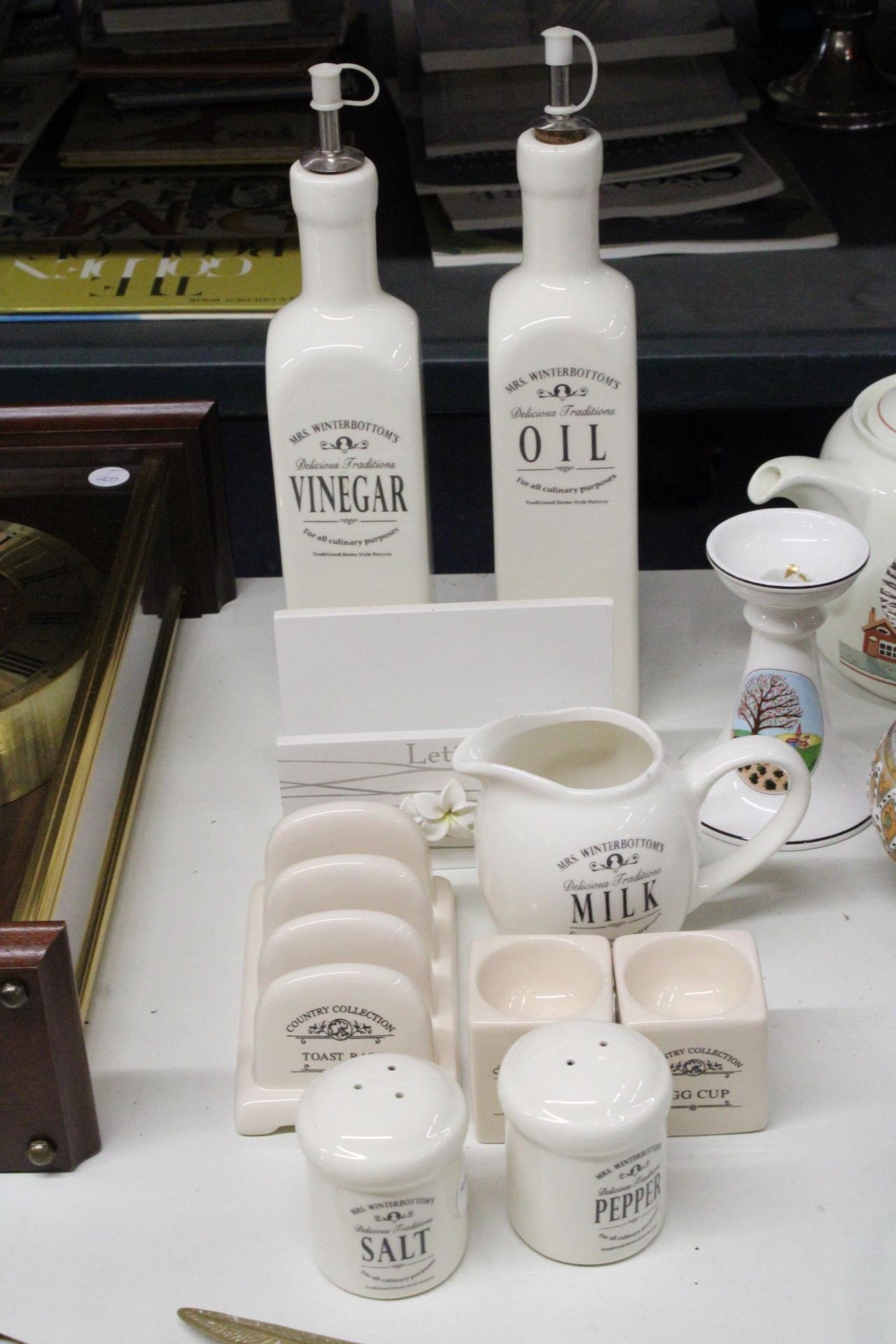 A SET OF MRS WINTERBOTTOM'S 'DELICIOUS TRADITIONS' TABLEWARE TO INCLUDE A MILK JUG, OIL AND