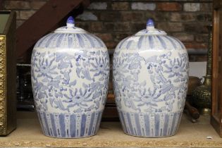 A PAIR OF LARGE BLUE AND WHITE LIDDED JARS, HEIGHT APPROX 32CM