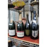 FOUR GLASS CHAMPAGNE DISPLAY BOTTLES