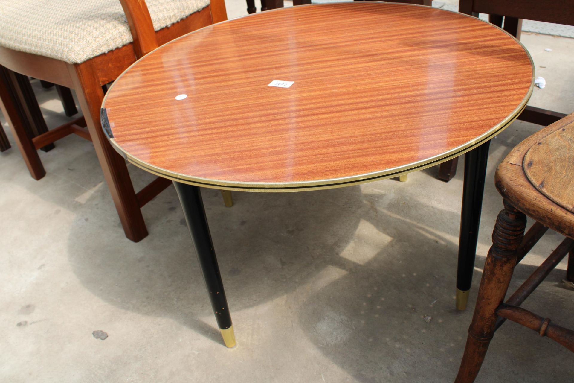 A RETRO TEAK McINTOSH CARVER CHAIR AND 28" DIAMETER FORMICA TOP COFFEE TABLE ON BLACK TAPERING LEGS - Image 2 of 3