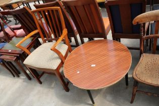 A RETRO TEAK McINTOSH CARVER CHAIR AND 28" DIAMETER FORMICA TOP COFFEE TABLE ON BLACK TAPERING LEGS