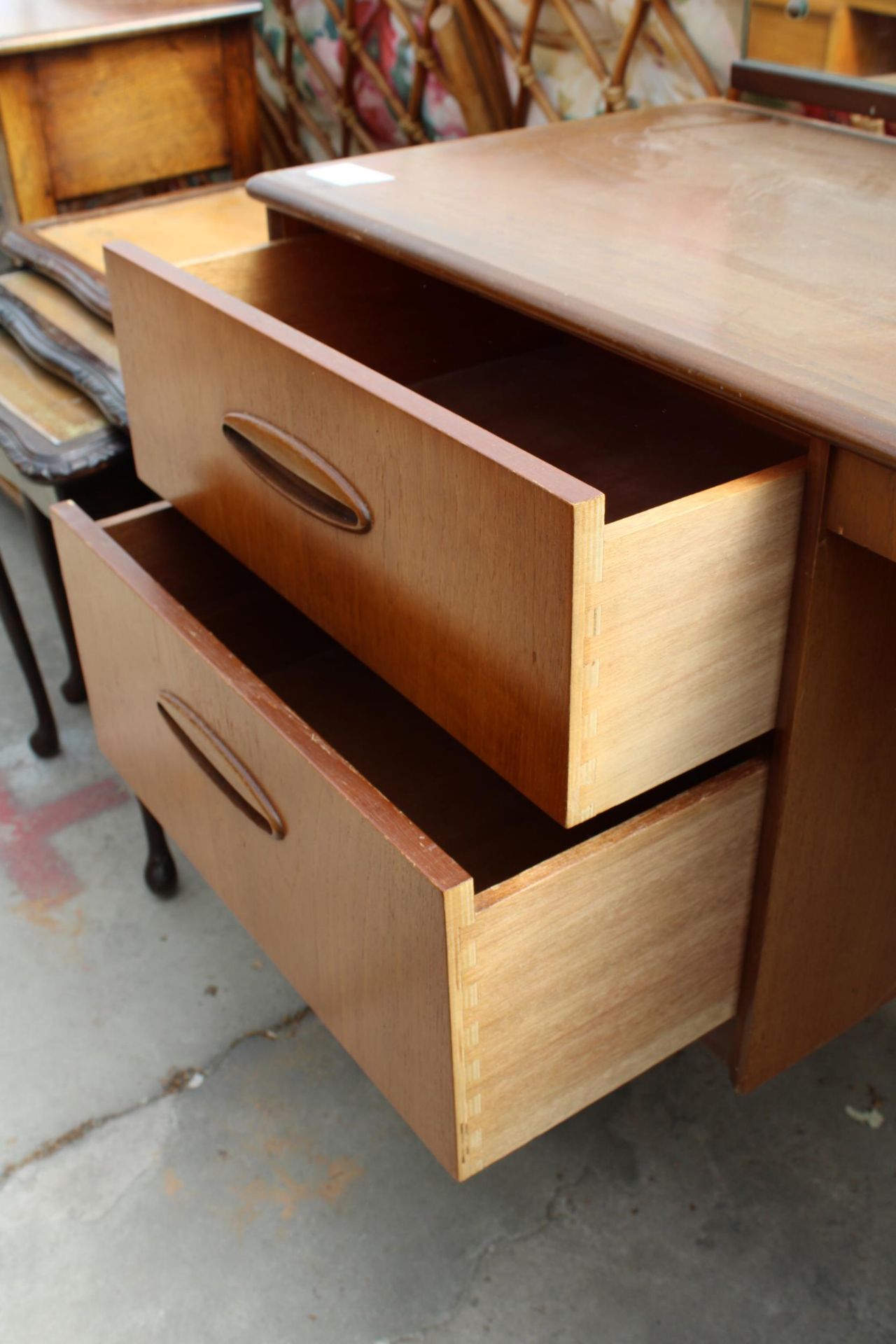 A RETRO TEAK KNEE-HOLE DRESSING TABLE ENCLOSING FOUR DRAWERS, 60" WIDE - Image 5 of 5