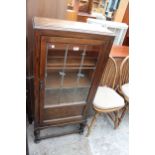AN EARLY 20TH CENTURY OAK GLAZED AND LEADED DISPLAY CABINET ON OPEN BASE, 23.5" WIDE