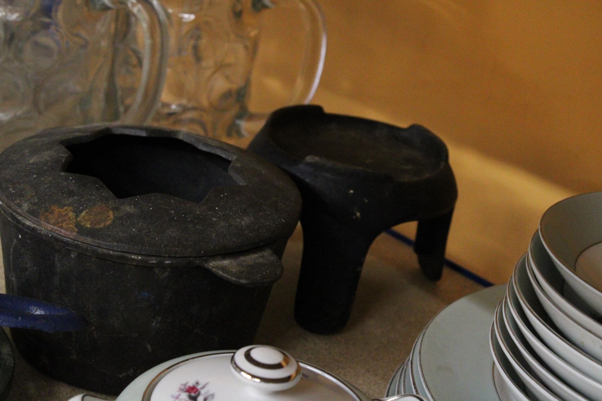 A CAST IRON COOK POT ON STAND PLUS TWO KETTLE STANDS AND CANDLE HOLDER - Image 4 of 4