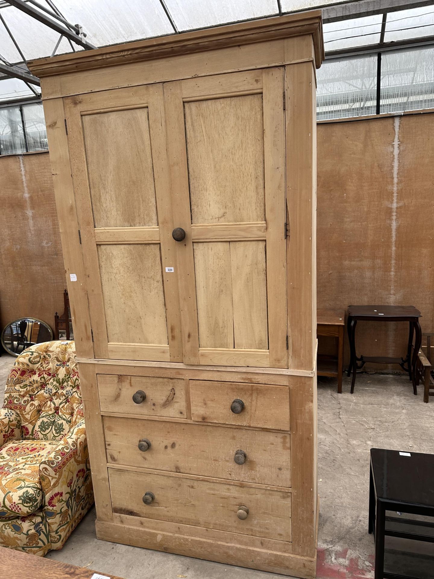 A VICTORIAN PINE TWO DOOR HOUSEKEEPERS CUPBOARD WITH TWO SHORT AND TWO LONG DRAWERS TO BASE, 48"
