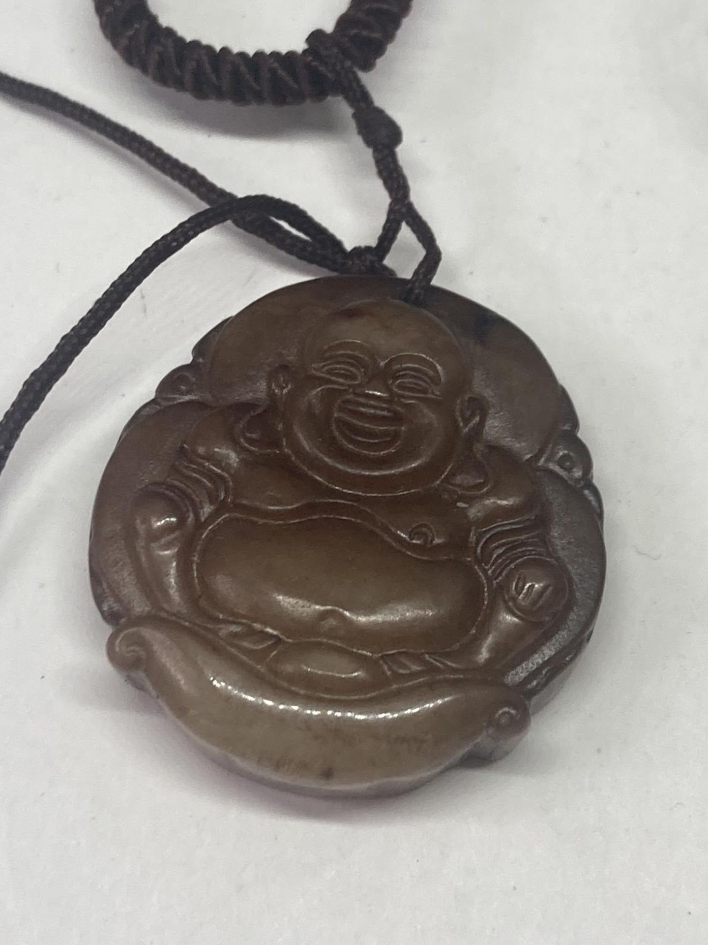 TWO NECKLACES TO INCLUDE A CARVED BUDDHA PENDANT AND A TALISMAN GOOD LUCK AMULET BOTH ON A LEATHER - Image 5 of 8