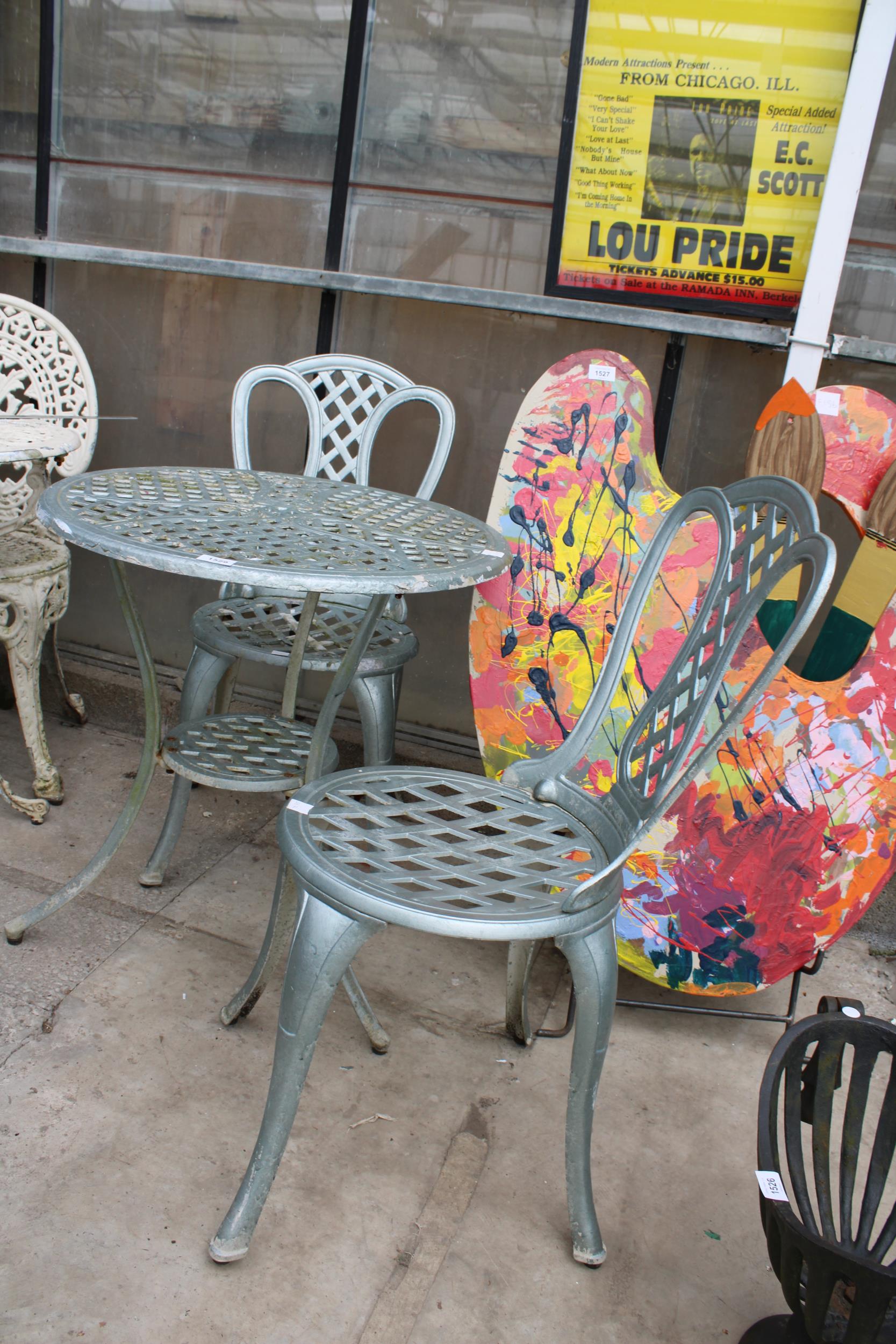 A CAST ALLOY BISTRO SET COMPRISING OF A ROUND TABLE AND TWO CHAIRS - Image 2 of 2