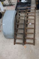 A PAIR OF METAL CAR RAMPS AND TWO METAL WHEEL ARCHES