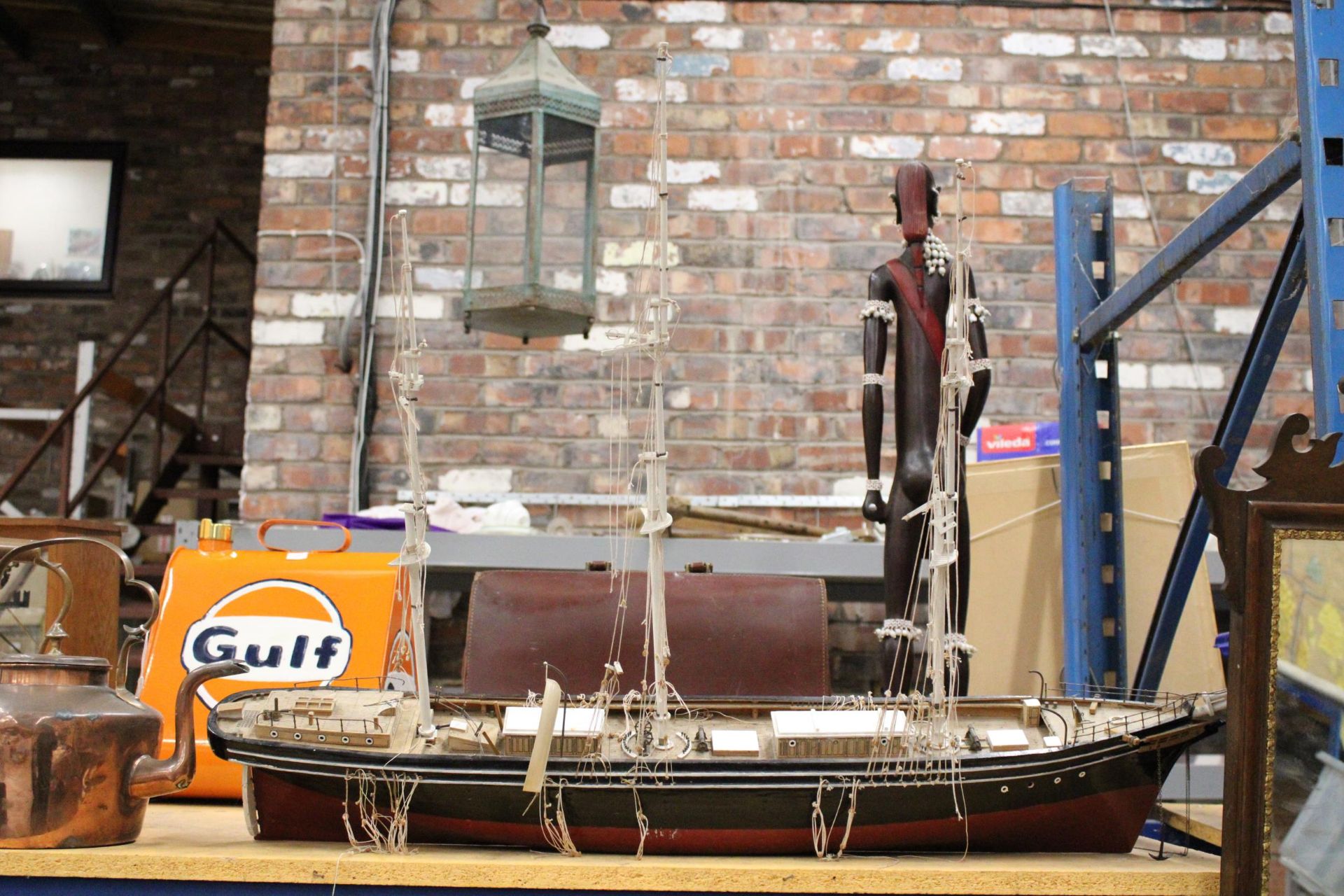 A LARGE WOODEN MODEL OF A SAILING SHIP WITH RIGGING, ETC., - LENGTH APPROX 1 METRE