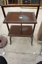 A MID 20TH CENTURY OAK TWO TIER AFTERNOON TEA STAND