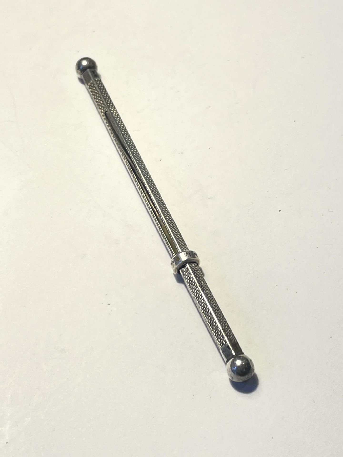 A MARKED STERLING SILVER RETRACTABLE STIRRER - Image 4 of 4