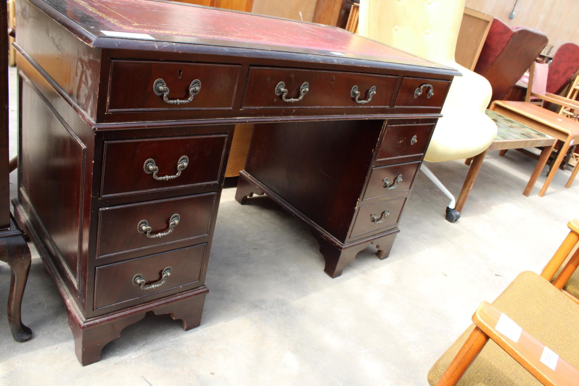 A MAHOGANY TWIN-PEDESTAL DESK ENCLOSING EIGHT DRAWERS AND INSET LEATHER TOP, 48" X 24" - Image 2 of 4