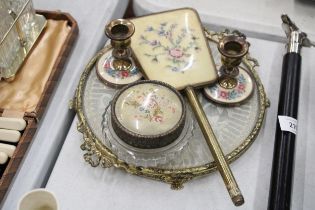 A VINTAGE 'PETIT-POINT' DRESSING TABLE SET TO INCLUDE, CANDLESTICKS, A HAND MIRROR, LIDDED TRINKET