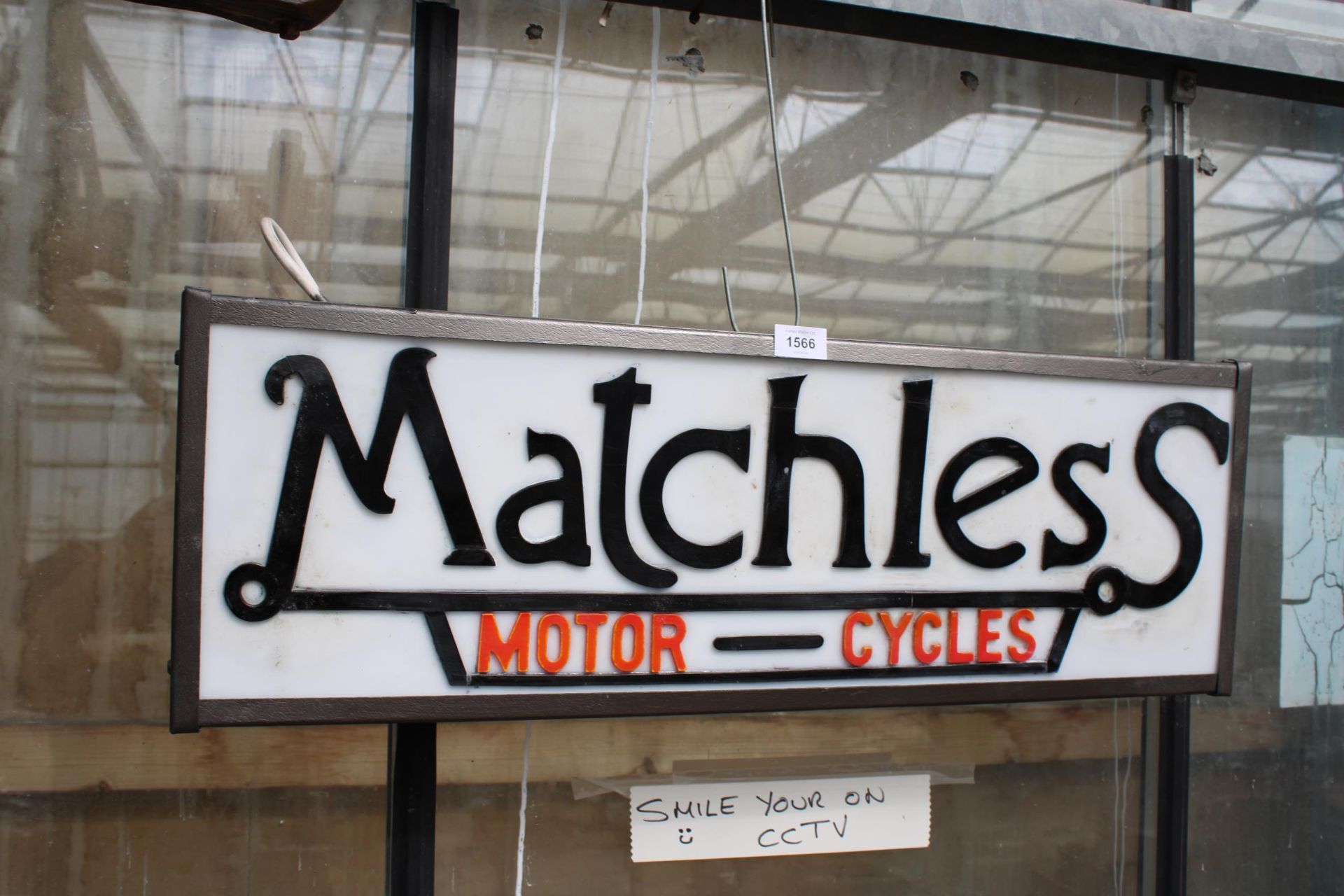 AN ILLUMINATED MATCHLESS MOTOR-CYCLES SIGN