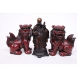 A PAIR OF CHINESE FOO DOGS AND A CHINESE WISEMAN