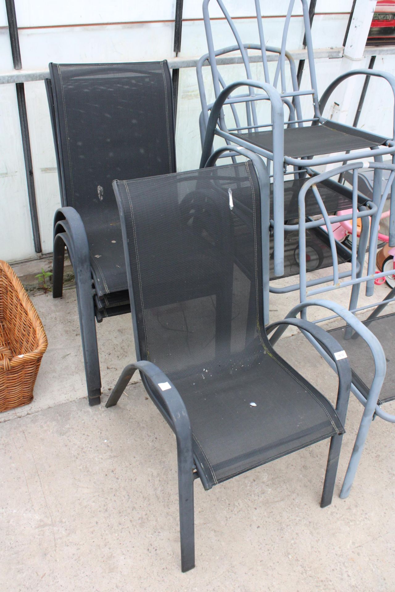 FOUR METAL FRAMED STACKING GARDEN CHAIRS