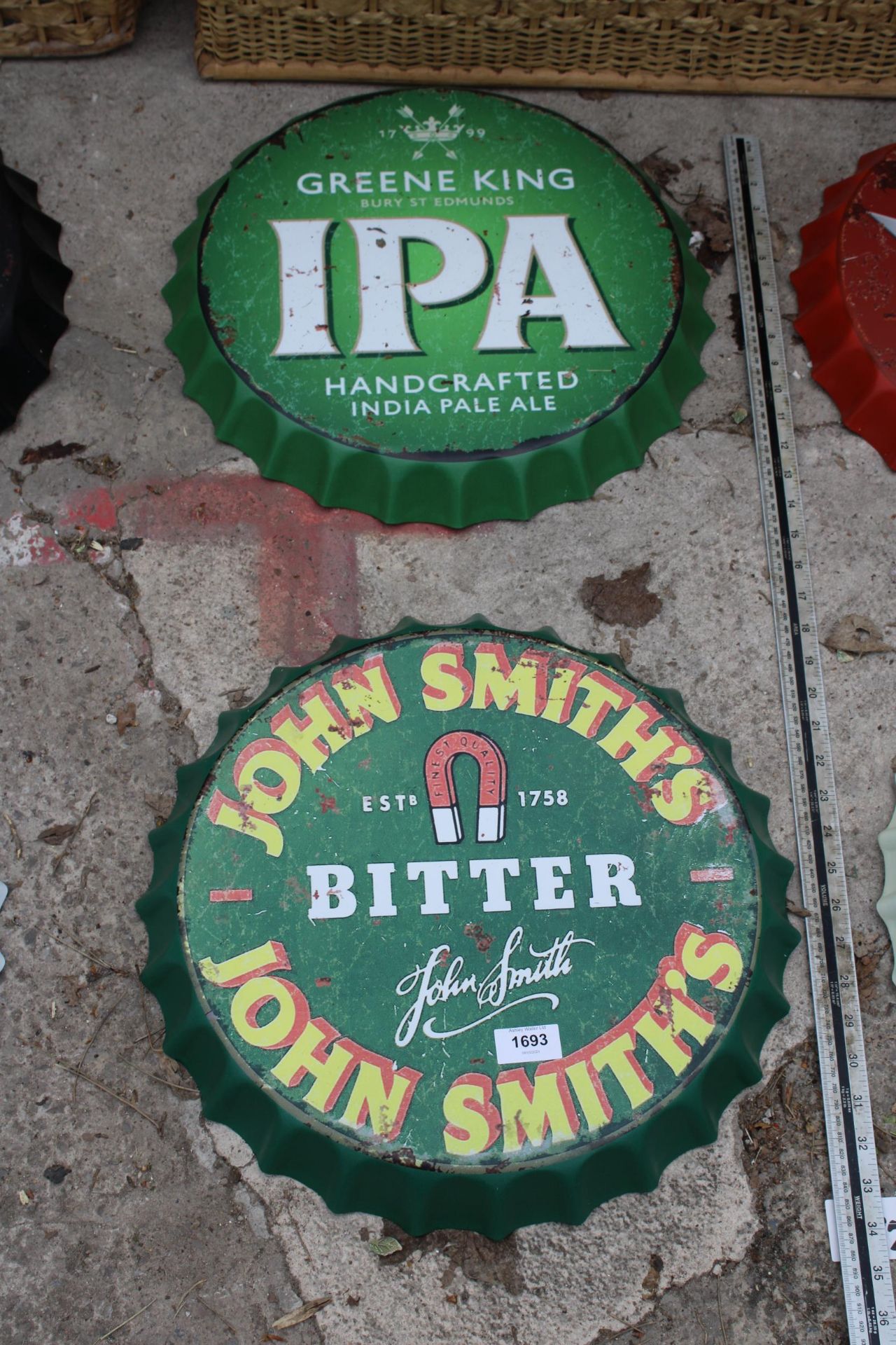 TWO BOTTLE CAP STYLE SIGNS TO INCLUDE JOHN SMITHS ETC