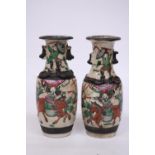 A PAIR OF CHINESE CRACKLE GLAZED VASES WITH WARRIOR SCENES - 18 CM (H) - MARK TO BASE