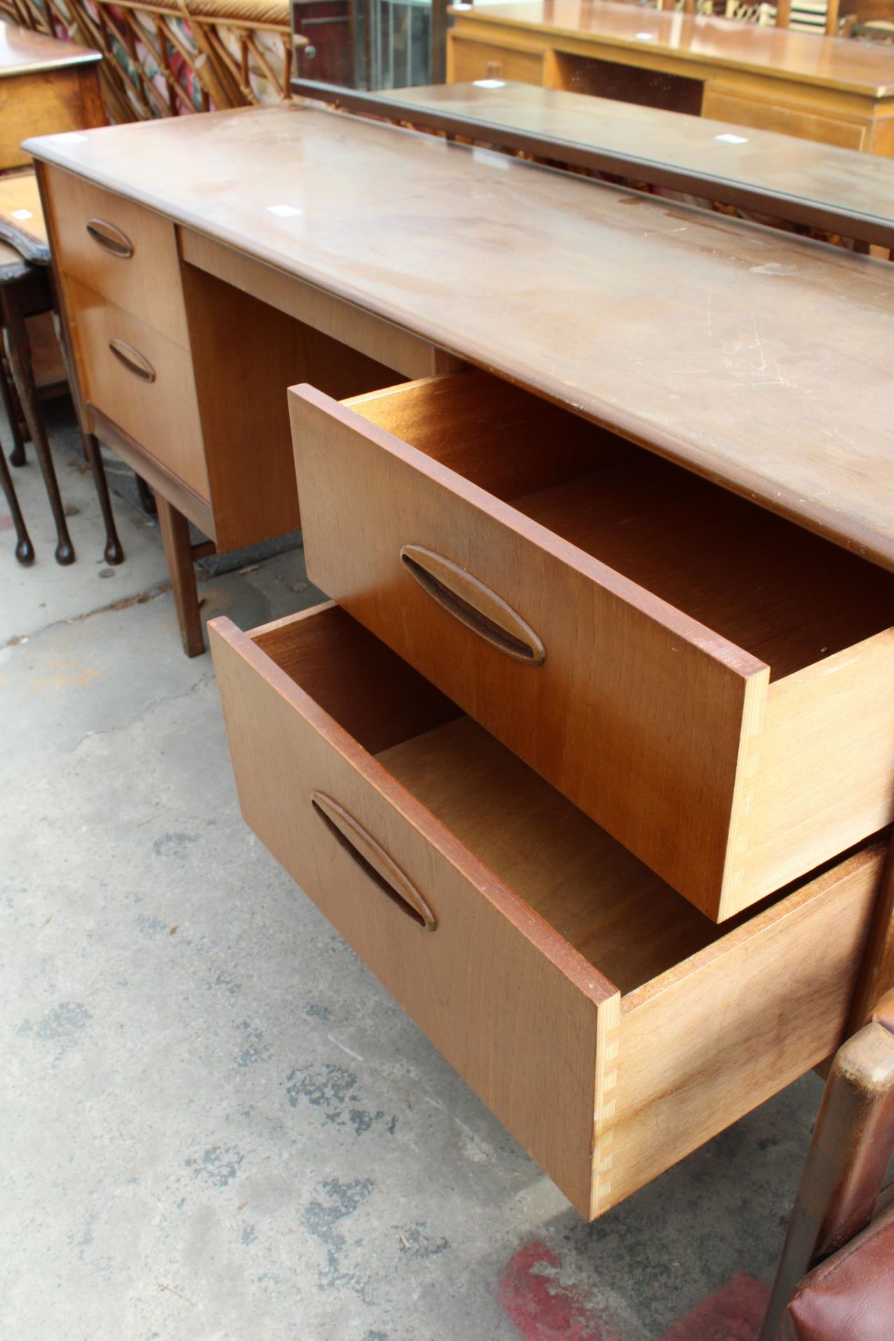 A RETRO TEAK KNEE-HOLE DRESSING TABLE ENCLOSING FOUR DRAWERS, 60" WIDE - Image 4 of 5