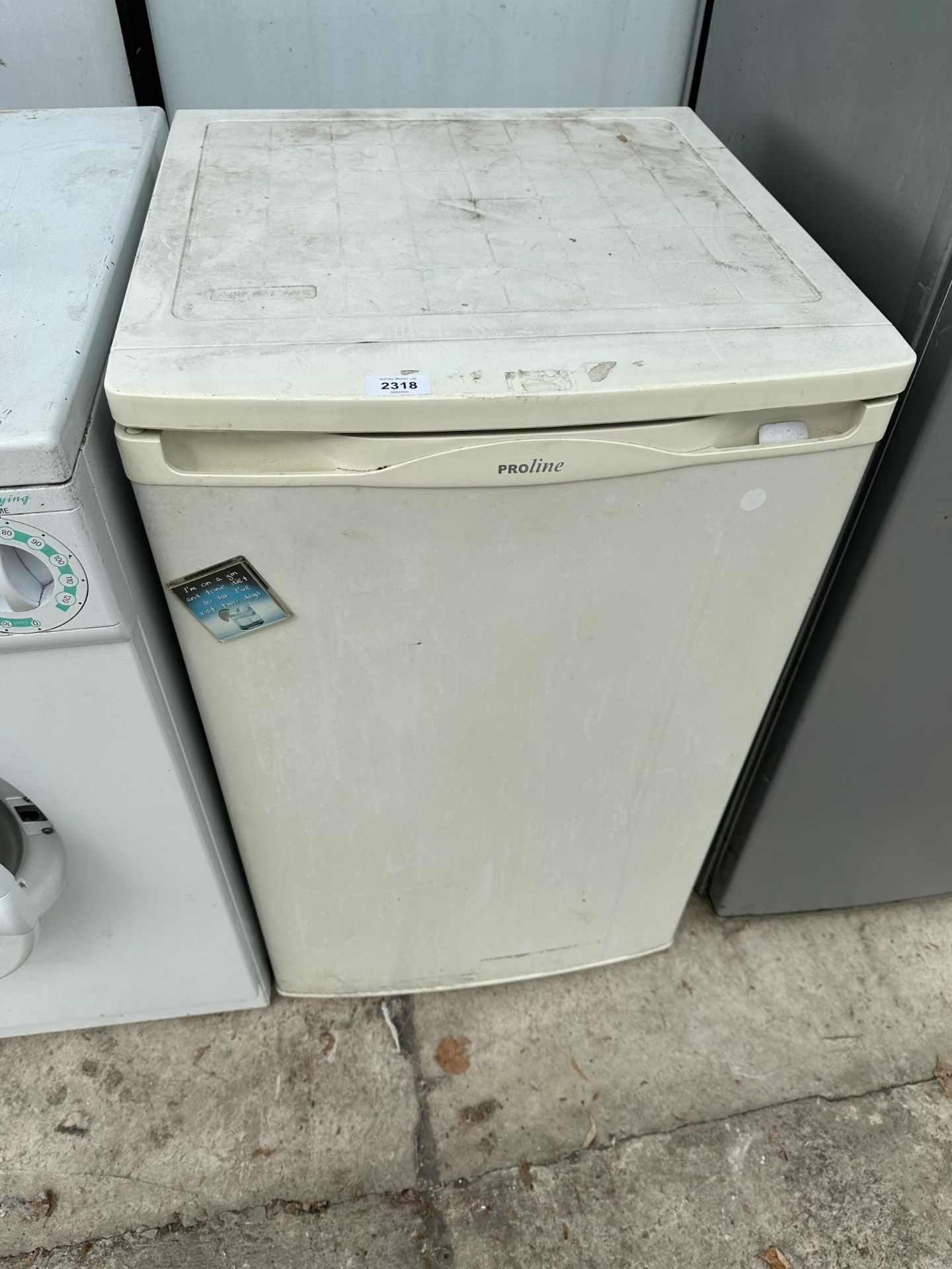 A WHITE PROLINE UNDERCOUNTER FRIDGE