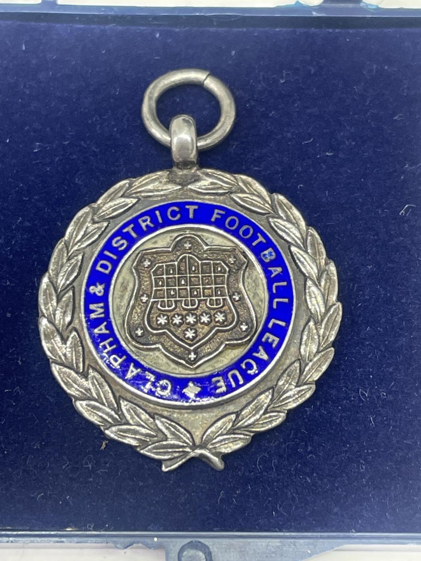 A HALLMARKED BIRMINGHAM SILVER FOOTBALL MEDAL IN A PRESENTATION BOX