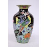 A VINTAGE MID CENTURY JAPANESE VASE FEATURING COLOURFUL PHEASANTS, LOTUS AND CHERRY BLOSSOMS ON A