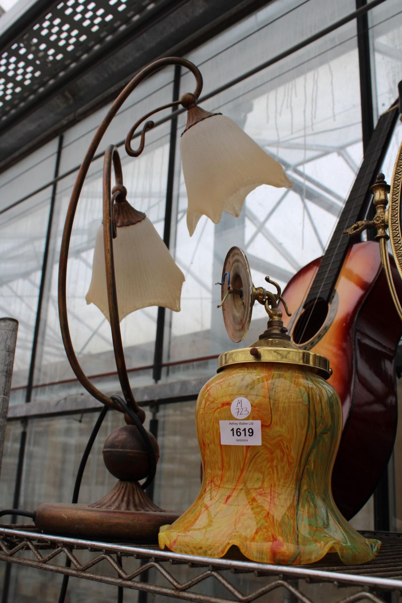 A DECORATIVE TABLE LAMP AND A CEILING LIGHT FITTING WITH VIVID GLASS SHADE