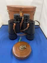 A PAIR OF KRIEGSTETTEN - GAMA BINOCULARS IN A LEATHER CASE WITH A VINTAGE LEATHER TAPE MEASURE