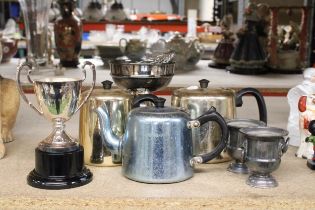 TWO SILVER PLATED TROPHIES, ONE BEING A ROSE BOWL, THREE TEAPOTS AND TWO SMALL URNS