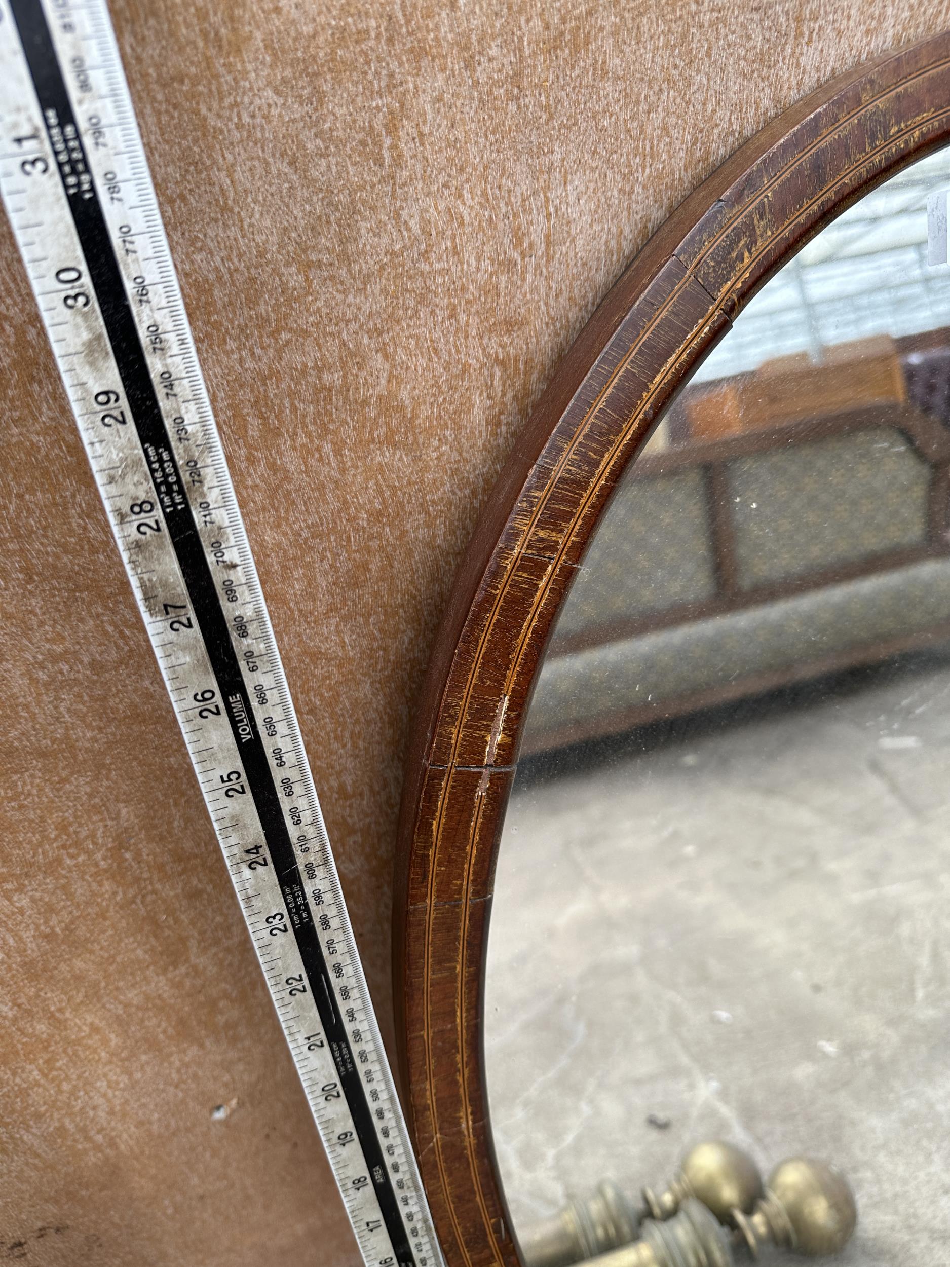 AN OVAL MAHOGANY MIRROR - Image 2 of 2