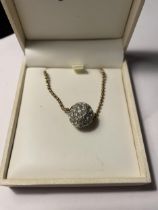 A SILVER GILT BALL NECKLACE WITH A CRYSTAL BALL PENDANT IN A PRESENTATION BOX