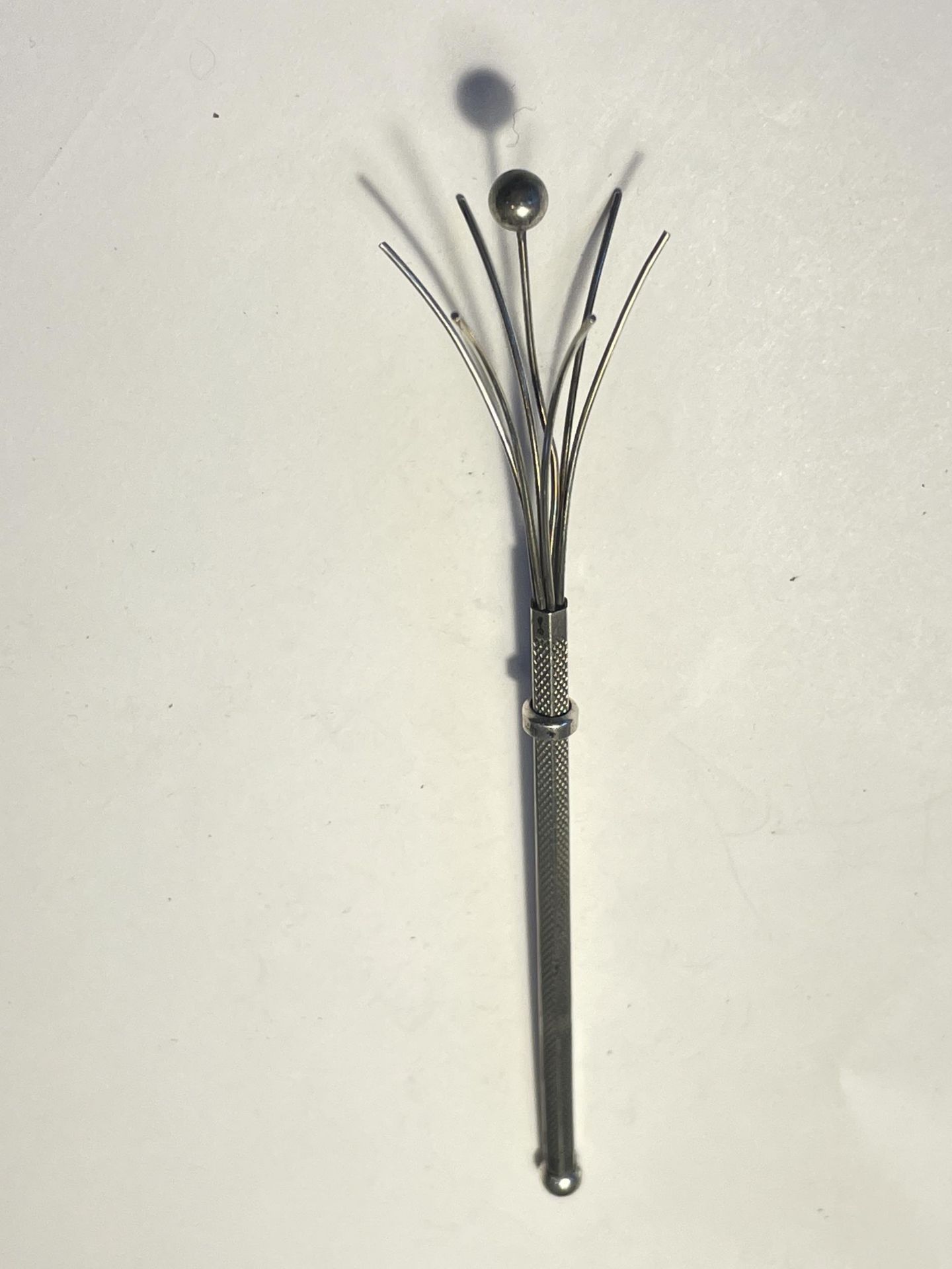 A MARKED STERLING SILVER RETRACTABLE STIRRER