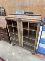 A MID 20TH CENTURY OAK TWO DOOR DISPLAY CABINET, 36" WIDE