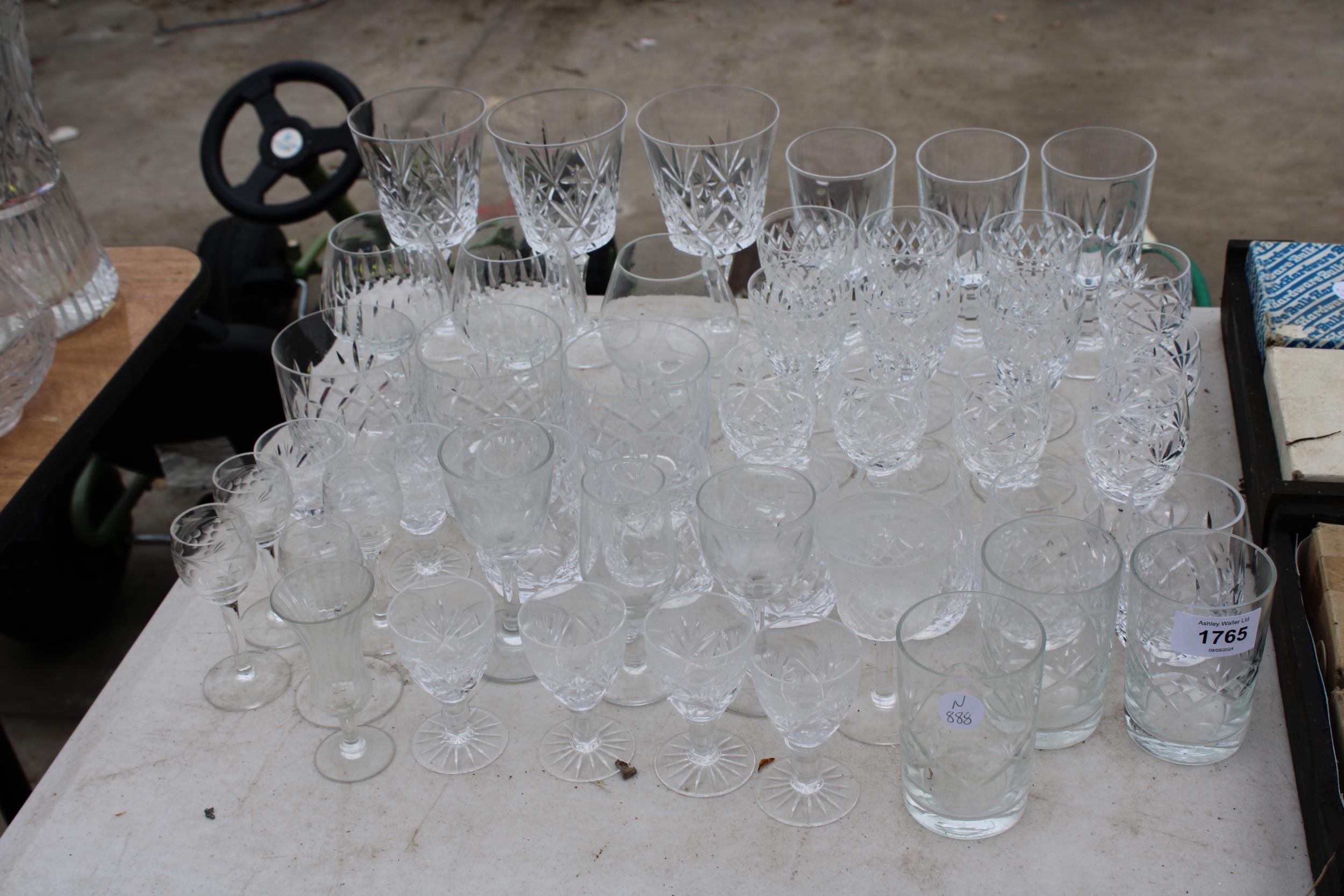 AN ASSORTMENT OF CUT GLASS WARE TO INCLUDE WINE GLASSES AND BRANDY BALLOONS ETC