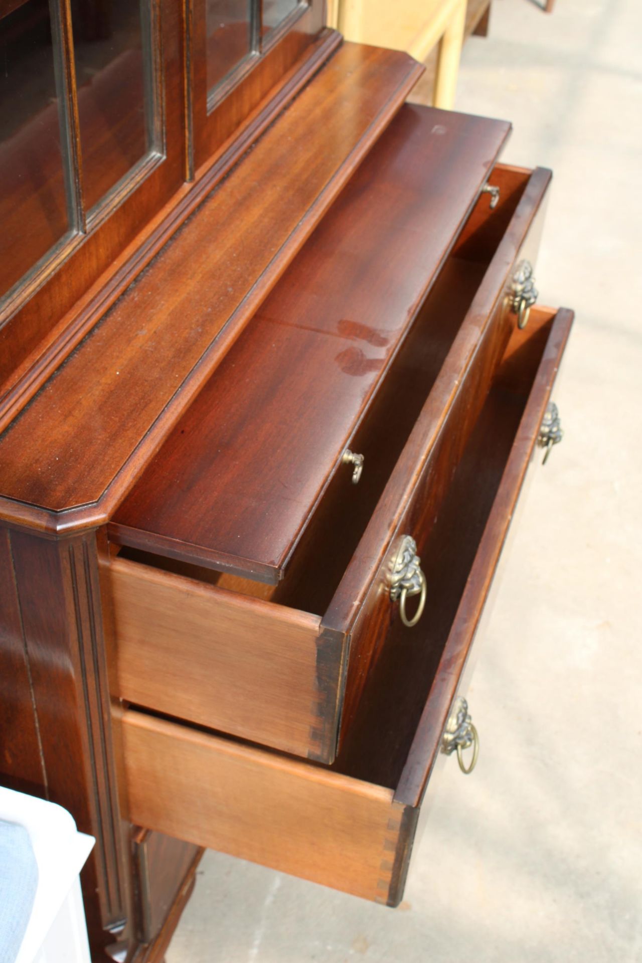 A MAHOGANY REPRODUX, BEVAN FUNNELL TWO DOOR BOOKCASE ON BASE WITH THREE DRAWERS AND SLIDE, 30" - Image 4 of 5