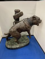A LARGE BRONZE FIGURE OF A CHAINED UP DOG HEIGHT APPROXIMATELY 33CM