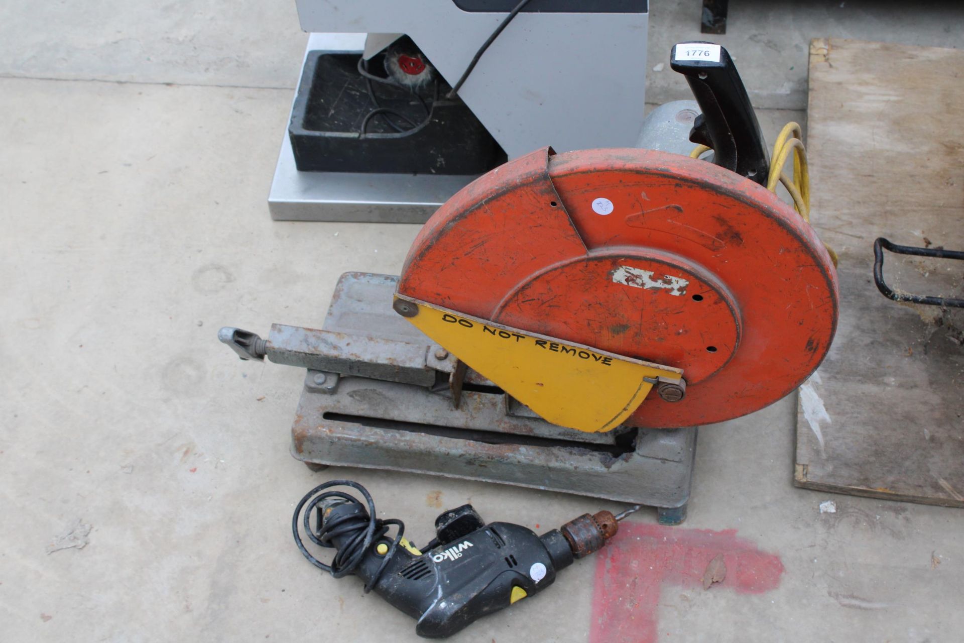 A 110V METAL CUTTING CIRCULAR SAW AND A WILKO ELECTRIC DRILL