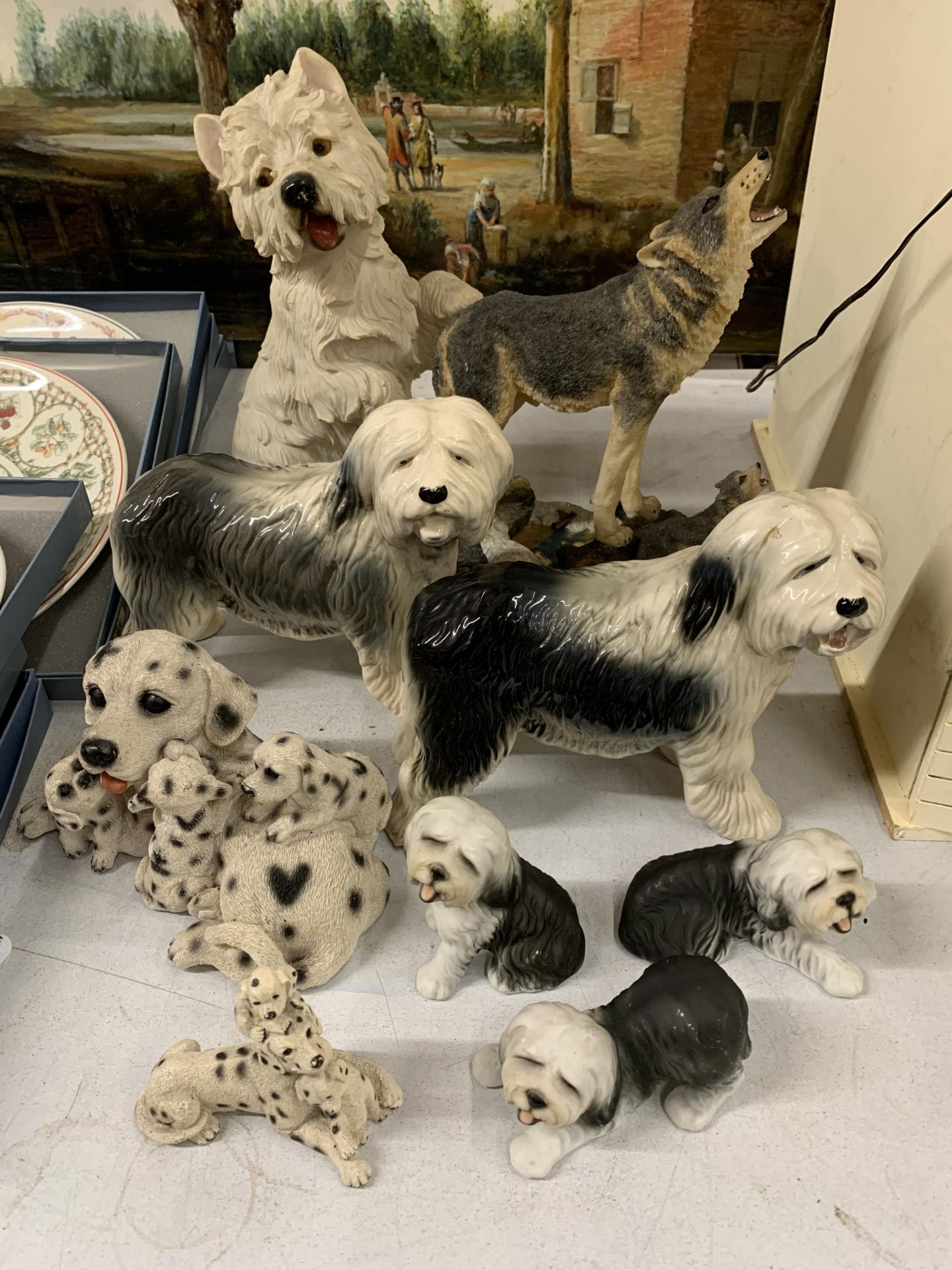 A QUANTITY OF NINE DOG RELATED ORNAMENTS TO INCLUDE WESTIES, DALMATIANS, SHEEPDOGS ETC