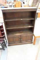 AN ELM ERCOL STYLE OPEN BOOKCASE WITH CUPBOARDS TO BASE - 40" WIDE