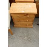 A PINE BEDSIDE CHEST OF THREE DRAWERS, 20" WIDE