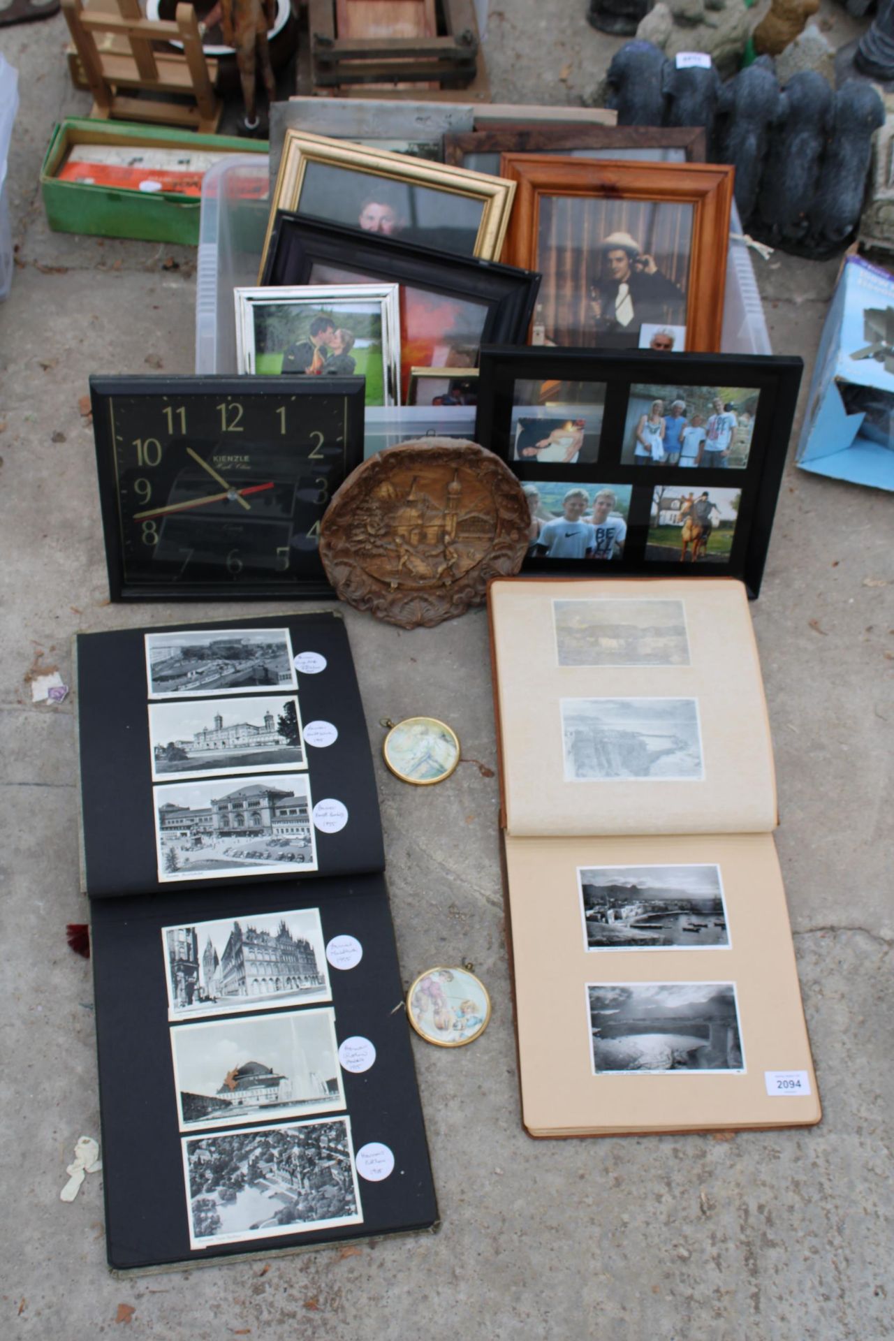 AN ASSORTMENT OF FRAMED PRINTS AND TWO PHOTO ALBUMS